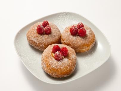 Ginger donuts made by finalist Carla Johnson for the final episode and challenge of Worst Bakers In America.  Carlas donuts were made with a ginger cream filling on the inside, and covered with a cinnamon, white powder suger, and rasberry's, as seen on Food Network's Worst Bakers In America, Season 1.