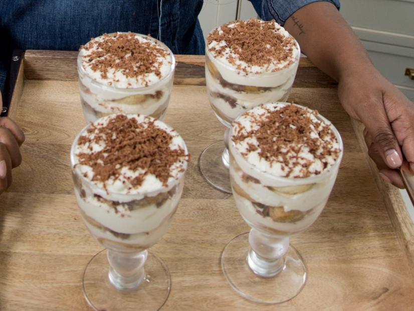Host Ayesha Curry with her Tiramisu for the Godfather episode, as seen on Food Network’s Ayesha’s Homemade, Season 1.