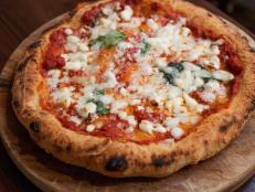 <p>When New Yorkers and Italians call it the best pizza they&rsquo;ve ever had, it has to be legit. Guy digs into the pistachio and sausage pizza fresh out of the wood-fired oven imported from Naples. He also can&rsquo;t get enough of the Montanara Starita, a fried pizza with a smoky flavor and fluffy crust.</p>