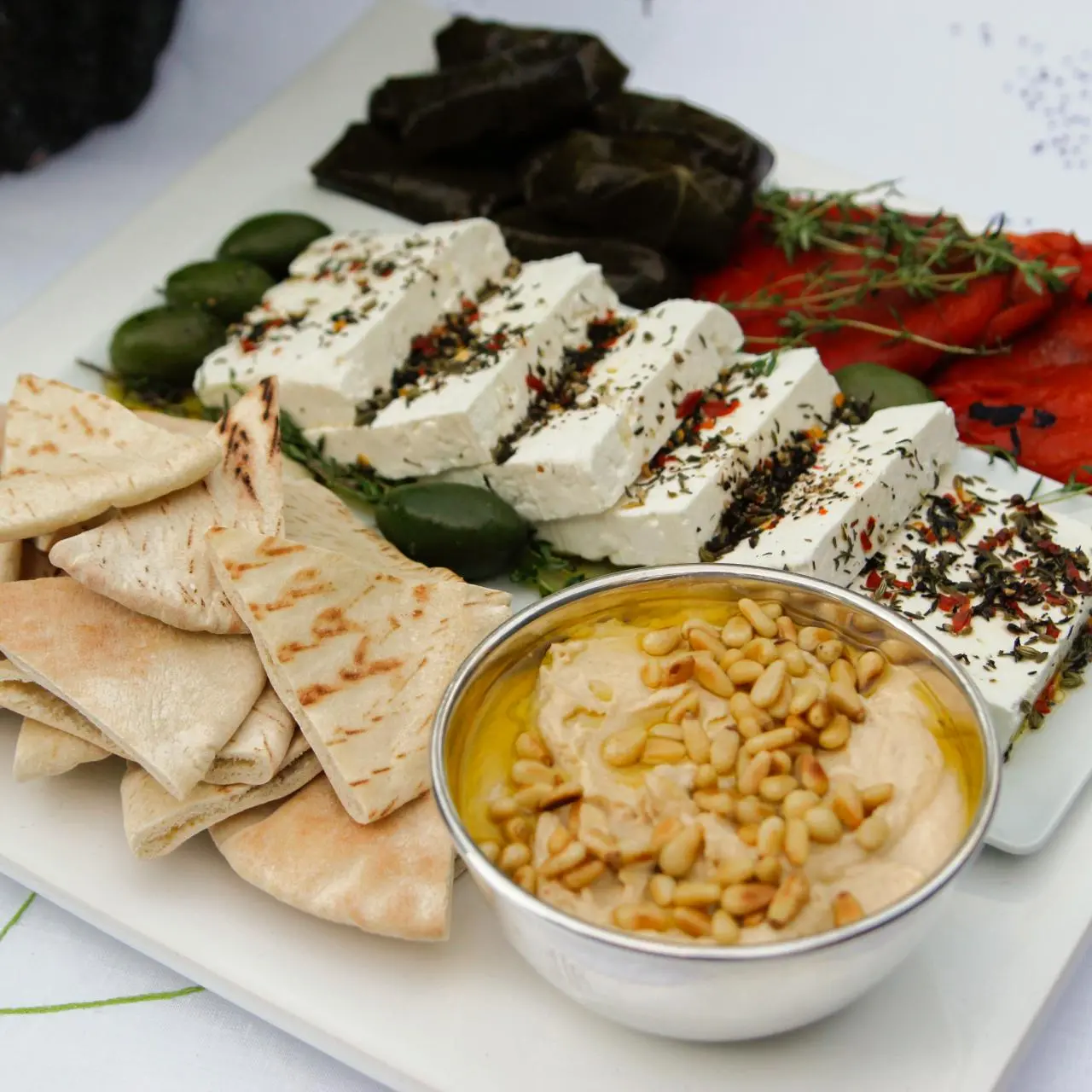 https://food.fnr.sndimg.com/content/dam/images/food/fullset/2016/10/4/4/BX1205H_Greek-mezze-platter_s4x3.jpg.rend.hgtvcom.1280.1280.suffix/1478638885174.webp