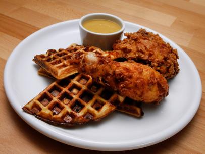 Mentor Anne Burrell's Cheddar Scallion Waffles with Dijon Buttermilk Fried Chicken is displayed, as seen on Food Network's Worst Cooks in America, Season 9.