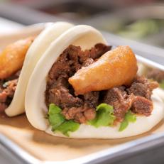 A pair of Kalbi buns as served at Bun Shop in Los Angeles, CA as seen on Food Network's Diners, Drive-Ins and Dives episode 2508.