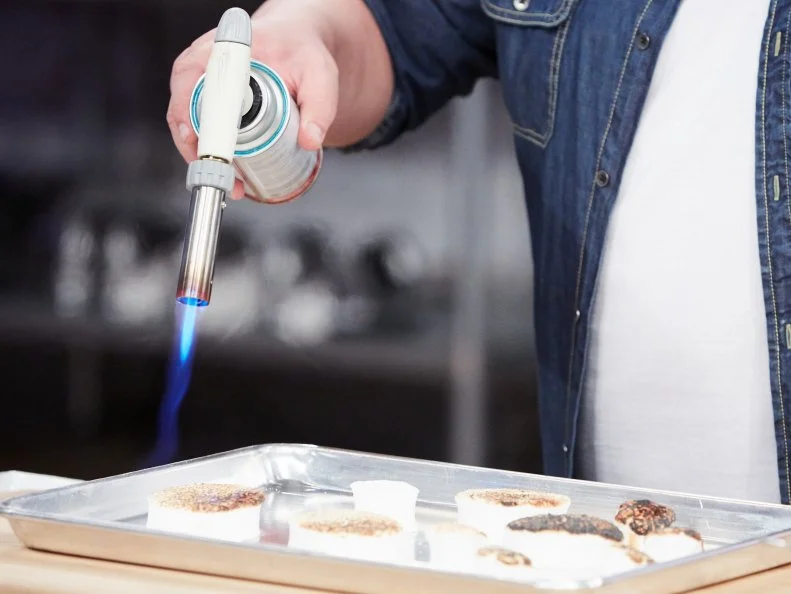 Host Duff Goldman preparing his dish, Homemade S'Mores, as seen on Food Network's Holiday Baking Championship: Duff's Sweet Spot, Season 3.