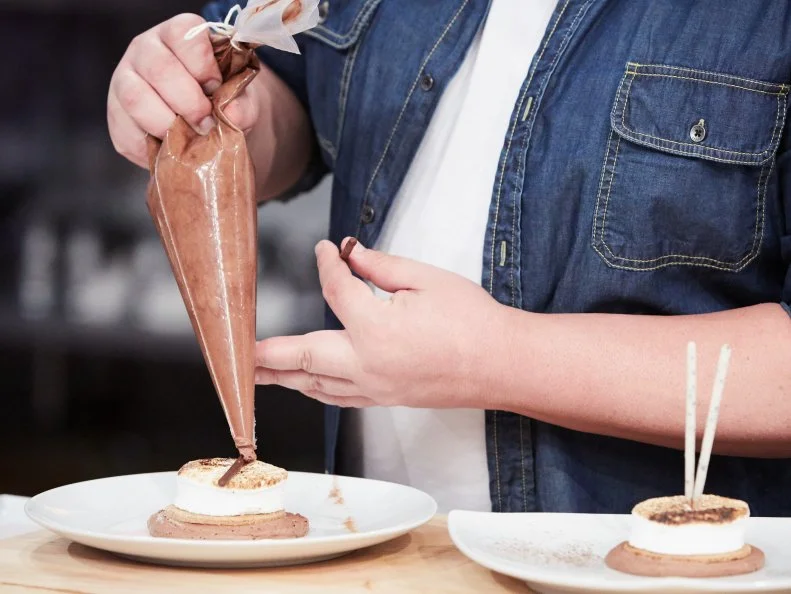 Host Duff Goldman preparing his dish, Homemade S'Mores, as seen on Food Network's Duff's Sweet Spot, Season 3.