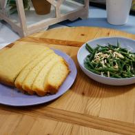 Marcela Valladolid's slow cooker cornbread and Geoffrey Zakarian's toaster oven green beans are displayed, as seen on Food Network's The Kitchen, Season 11.