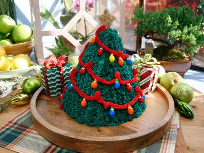 Guest Elise Strachan's Christmas Tree Surprise Cake is displayed, as seen on Food Network's The Kitchen, Season 11.