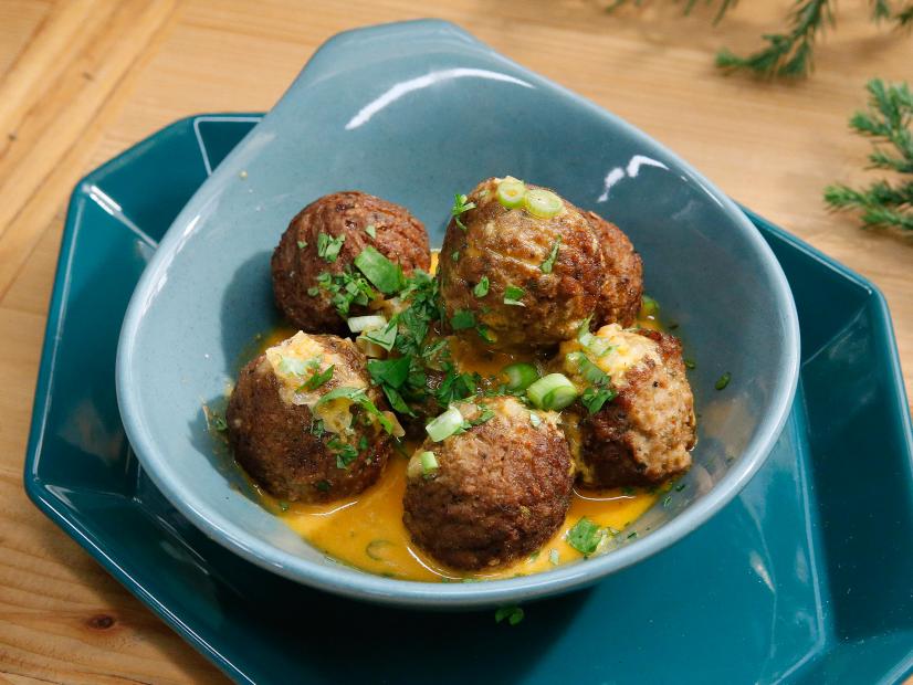 Katie Lee's Veggie Meatballs with Coconut Red Curry Sauce are displayed, as seen on Food Network's The Kitchen, Season 11.