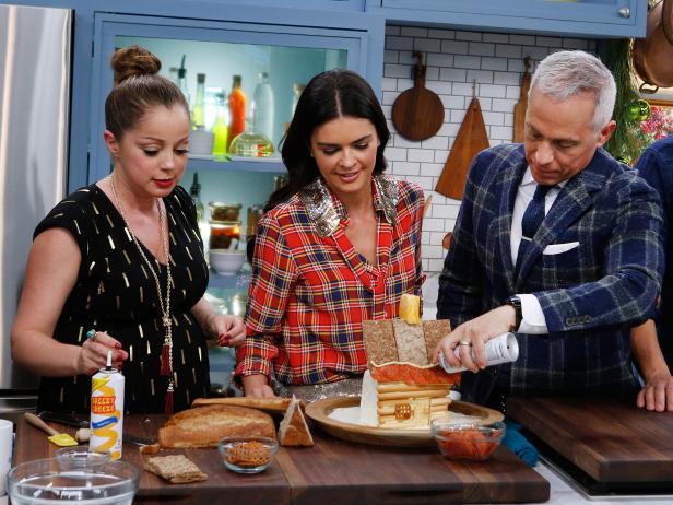 Hosts Marcela Valladolid, Katie Lee and Geoffrey Zakarian demonstrate how to make a Cheese and Cracker House, as seen on Food Network's The Kitchen, Season 11.
