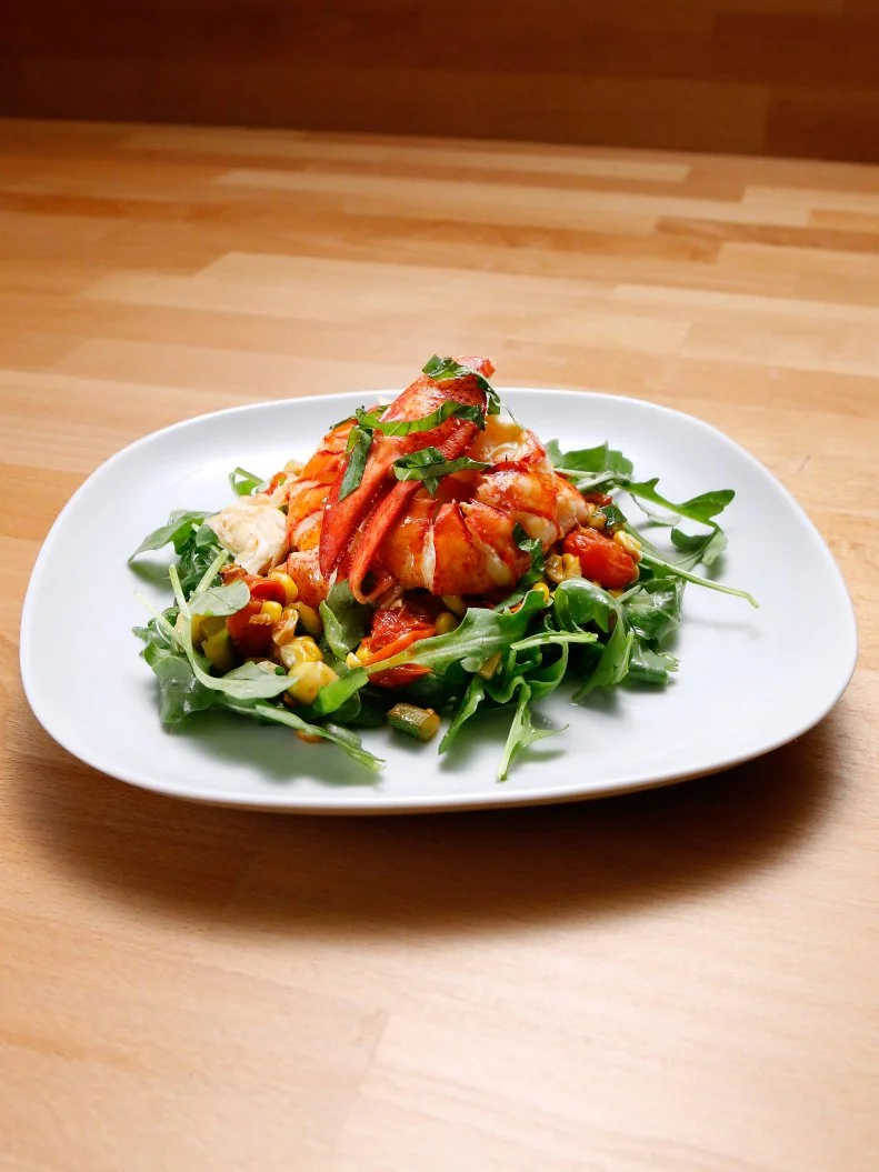 Mentor Anne Burrell's Poached Lobster over Corn and Cherry Tomato Salad is displayed, as seen on Food Network's Worst Cooks in America, Season 10.