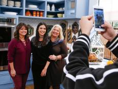Guests Valerie Bertinelli and Nancy Fuller poses for a photo with host Katie Lee, as seen on Food Network's The Kitchen, Season 11.