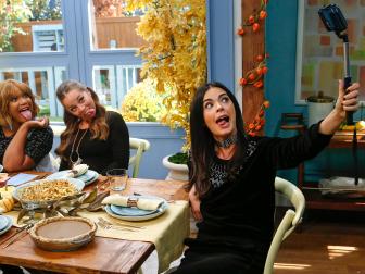 Host Katie Lee takes a selfie with fellow hosts Marcela Valladolid and Sunny Anderson, as seen on Food Network's The Kitchen, Season 11.