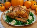 Geoffrey Zakarian's Lemon and Herb Roasted Turkey is displayed, as seen on Food Network's The Kitchen, Season 11.