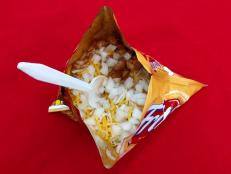 Rahm Fama grew up on the Frito Pie from Five & Dime General Store and he still eats it religiously today. The dish consists of corn chips, which are topped with New Mexico Chili, cheese and onions. Rahm loves the spicy and earthy flavors from the chili and gooey cheese; a perfect childhood memory.