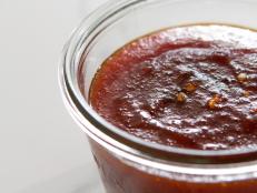 This simple jelly brings together the best things about hot sauce with a little sweet hit from the fruit. Including bell pepper enhances the chile flakes' natural peppery flavor. We love this with fresh biscuits or BLTs.
