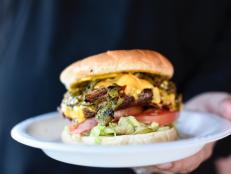 When Bobby heard that Manny's Buckhorn Tavern had the seventh best burger in the nation, he had to challenge them to a Green Chile Cheeseburger throwdown. The competition was tough, but in the end, Chef Bob Olguin's refried green chiles and toasted bun helped him take the prize.