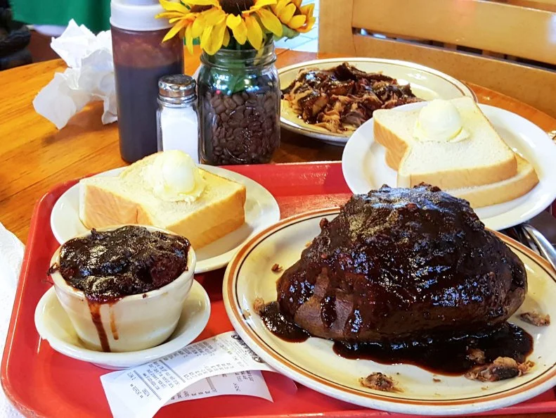 Pot-O-Beans, along with beef barbecue stuffed potato, pulled pork plate and breat at Stubby's Hik'ry Pit Bar-B-Que in Hot Springs, Arkansas as included in Arkansas's Most Iconic Eats for FoodNetwork.com