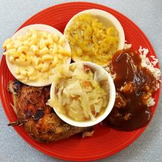 Steamed cabbage, baked chicken, mac and cheese, brown gravy with rice and stewed squash at R.A. Pickens and Son Commissary near Dumas, Arkansas as included in Arkansas's Most Iconic Eats for FoodNetwork.com