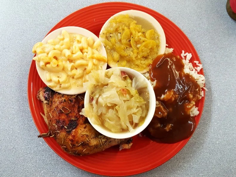 Steamed cabbage, baked chicken, mac and cheese, brown gravy with rice and stewed squash at R.A. Pickens and Son Commissary near Dumas, Arkansas as included in Arkansas's Most Iconic Eats for FoodNetwork.com