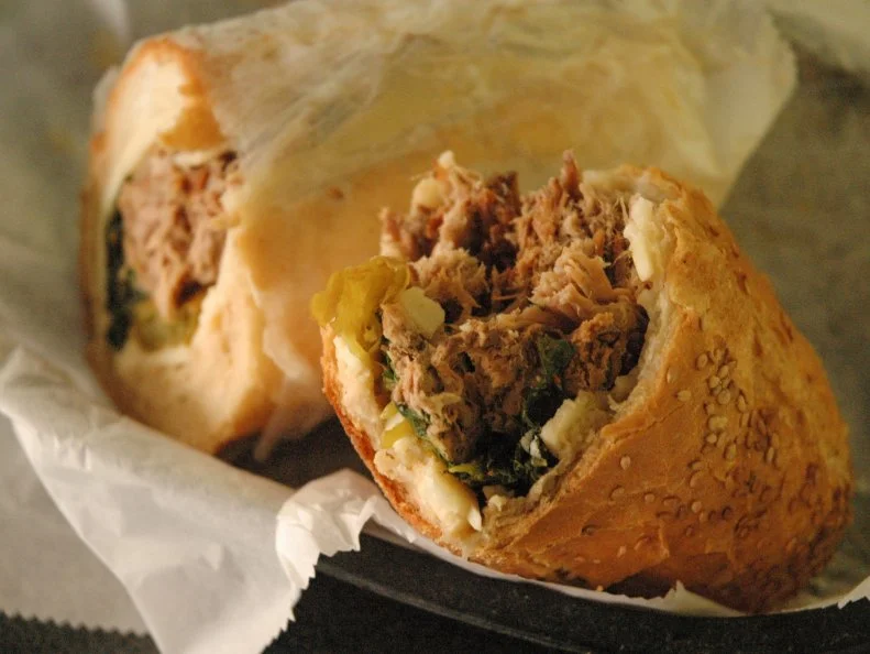 Philly may best known for its namesake cheesesteak, but many residents actually prefer the city’s other meaty signature sandwich: roast pork. Stuffed to the gills with roast pork, broccoli rabe, sharp provolone and long hots, this local creation may, in fact, be even more flavorful than the steak-and-Whiz mix. At Paesano’s, cheese and garlicky greens accented with hot peppers ooze into a greasy, mouthwatering mess of slow-roasted pulled pork on a seeded roll in what they call The Arista. Be prepared to wash your hands or go through some napkins after eating this juicy beast of a meal; it’s sure to make a mark on those who eat it.