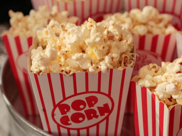 Picture of popcorn in a red and white striped box labelled "pop corn"