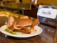 Cheeseburgers from Shady Glen in Manchester, Connecticut. The cheese is first fried on the griddle for a unique look, flavor, and taste.