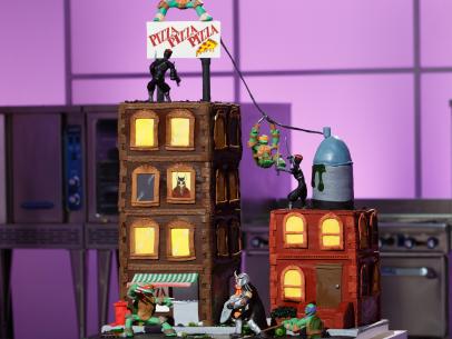 A TMNT-themed Chocolate Mocha Cake cake display prepared by Monika Stout during the final challenge, as seen on Food Network's Cake Wars, Season 4.