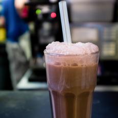 The New York Egg Cream contains neither eggs nor cream. Instead, it’s a strange-sounding, highly delicious combination of milk, seltzer and chocolate syrup (preferably Fox’s U-Bet), stirred together in a Coke-style glass just before serving, so it develops a nice, frothy head. Most historians say the egg cream was created in the early 1900s by Louis Auster, a Jewish candy shop owner, who sold 3,000 of them a day in his Brooklyn storefront, Ratner’s Dairy Restaurant. These days, the egg cream can be found at delis and diners throughout the boroughs. Shopsin’s, a tiny diner inside the Lower East Side’s Essex Street Market, serves one of the top renditions in town: rich and invigorating with a thick head and plenty of cascading, miniature bubbles. 