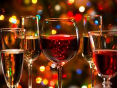 Crystal glasses of wine on the background of Christmas lights