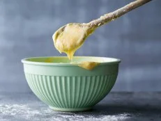 Raw cake dough in a mixing bowl