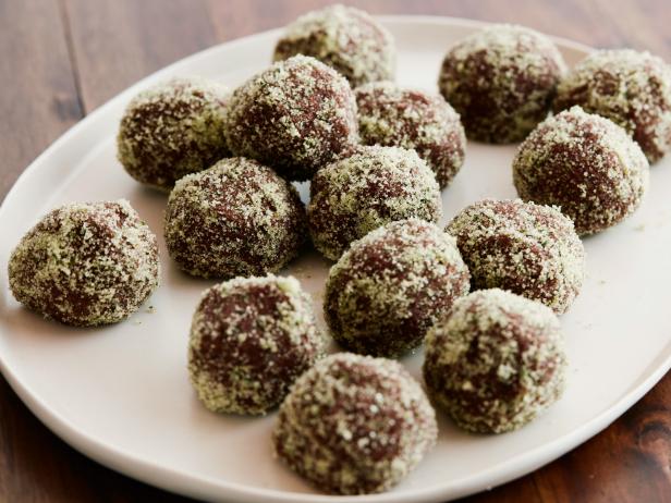 MINT JULEP TRUFFLES Food Network Kitchen Food Network Semisweet Chocolate, Milk Chocolate, Heavy Cream, Unsalted Butter, Bourbon, Peppermint Extract, Sugar, Mint Leaves