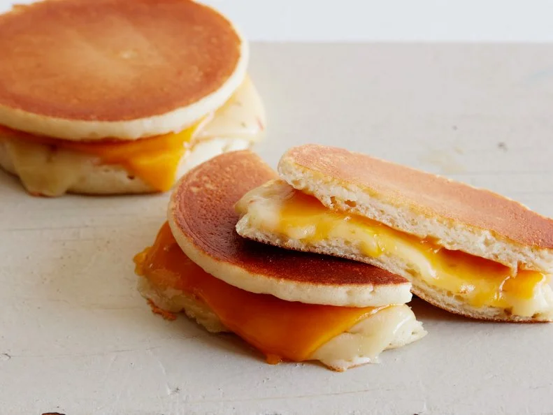 12 THINGS YOU SHOULD MAKE WITH PANCAKES  1. Pancake Grilled Cheese 2. BLT Pancake 3. Peanut Butter and Jelly Pancake Sandwich 4. Pancake Ice Cream Sandwich 5. Pancake Tacos 6. Pancake Whoopie Pies 7. PancakeCake 8. Pancake Bread Pudding 9. Pancake Parfait 10.Pancake Eggs Benedict 11.Pancake Quesadilla 12.Pancake Canapes 12 Things You Should Make with Pancakes Food Network Kitchen Food Network Grilled Cheese, BLT, Peanut Butter and Jelly, Tacos, Ice Cream Sandwich, Whoopie Pies, PancakeCake, Bread Pudding, Pancake Parfait, Eggs Benedict, Quesadilla, Canapes