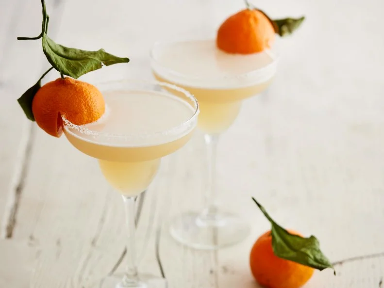 FNK ORANGE BLOSSOM MARGARITAS Food Network Kitchen Food Network Tequila, Limes, OrangeFlavored Liqueur, Orange Flower Water, Mandarin Orange, Honey