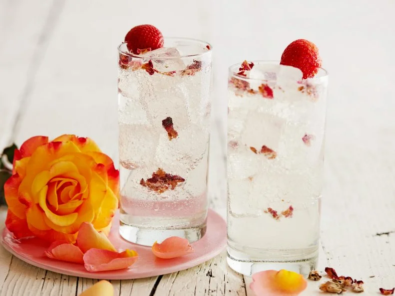 FNK ROSEWATER GIN AND TONIC Food Network Kitchen Food Network Dried Edible Rose Petals, Tonic Water, Gin, Rosewater, Strawberry