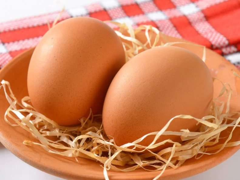 Fresh brown eggs in a bowl