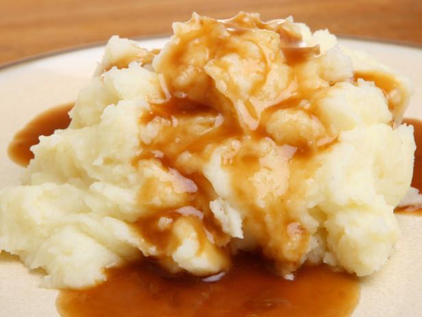 Mashed potato with gravy poured over.