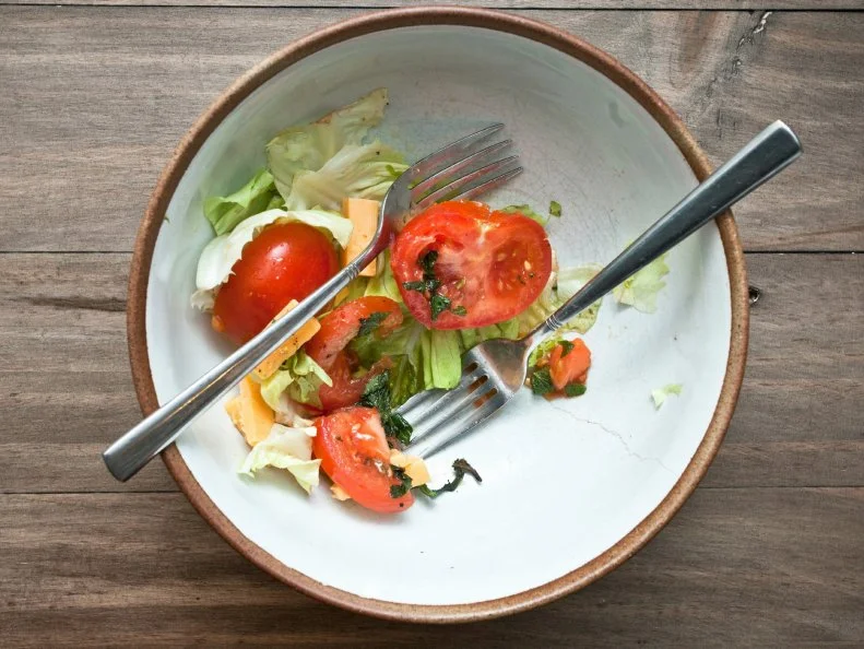 A half eaten fresh home meade salad