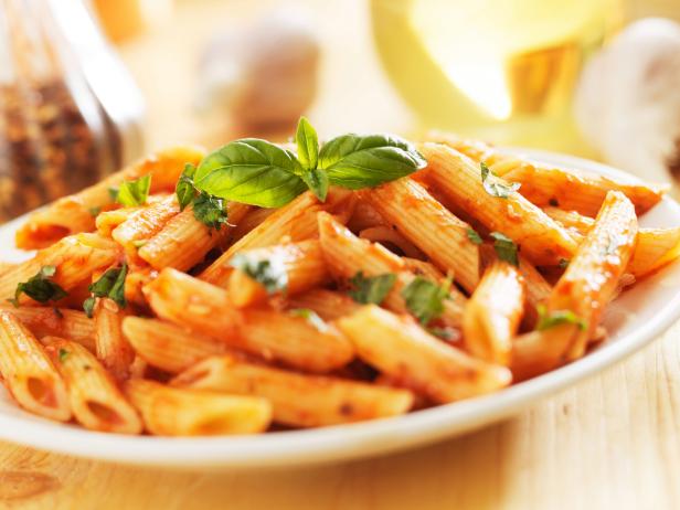 penne pasta smothered in tomato sauce