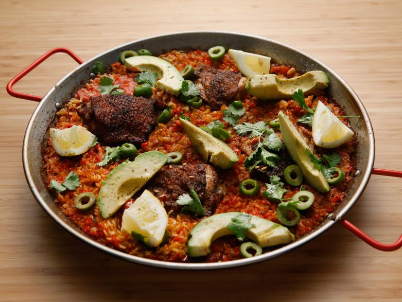 Host Tyler Florence's Pan Seared Chicken Thighs with Mexican Rice Paella Style with Avocado and Green Olives dish is displayed on the set of Food Network's Worst Cooks in America, Season 8.