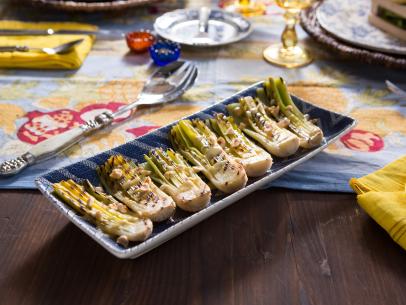 Beauty shot of the Grilled Leeks with Tarragon Vinaigrette during Farmers Market, as seen on Cooking Channel's Dinner at Tiffani's, Season 2.