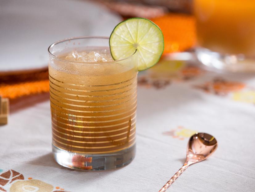 A "Dark and Stormy" cocktail topped off with ginger beer, prepared by host Tiffani Thiessen,  as seen on Cooking Channel's Dinner at Tiffani's, Season 2.