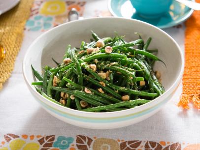 A string bean salad prepared by Tiffani Thiessen, which is based on her aunt's recipe, as seen on Cooking Channel's Dinner at Tiffani's, Season 2.