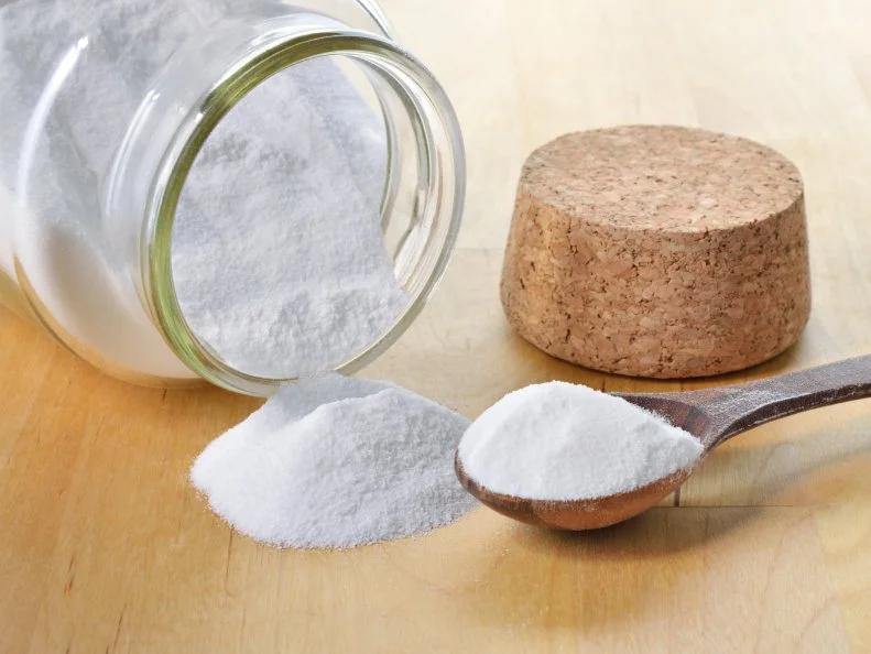 Close-up of baking soda in a glass jar. Bicarbonate of soda.