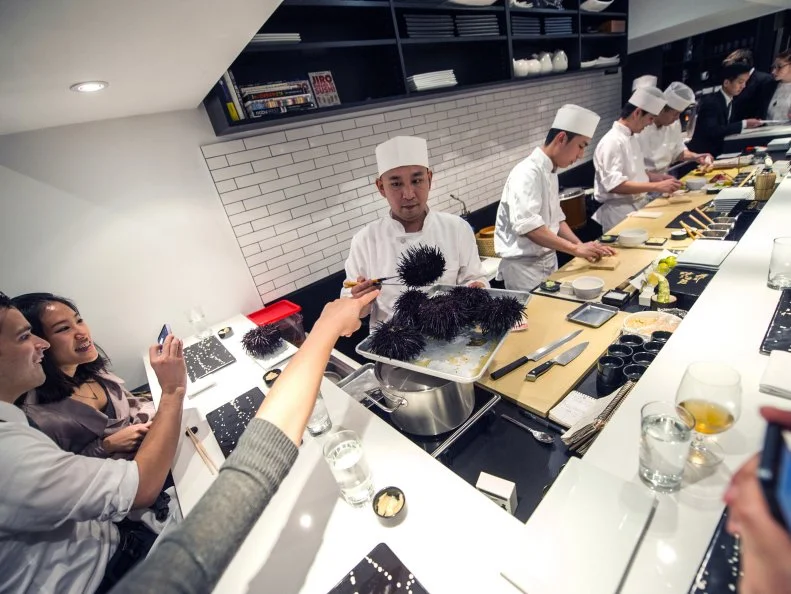 Daisuke Nakazawa presenting the live sea urchin