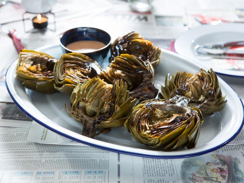 Beauty of Grilled Artichokes with Honey Chili Dipping Sauce during Surf and Turf, as seen on Cooking Channel's Dinner at Tiffani's, Season 2.