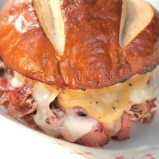 CU of Porkstrami Pretzel sandwich at the Food Fix Food Truck in Modesto, CA, as seen on Food Network's Diners, Drive-Ins and Dives, season 24.
