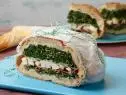 Food Network Kitchen’s Grilled Chicken and Kale Caesar Pressed Sandwich for Summer Slow Cooker/Zucchini Fries/Picnic Brick-Pressed Sandwiches, as seen on Food Network.