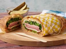 Food Network Kitchen’s Pork and Broccoli Rabe Pressed Sandwich for Summer Slow Cooker/Zucchini Fries/Picnic Brick-Pressed Sandwiches, as seen on Food Network.