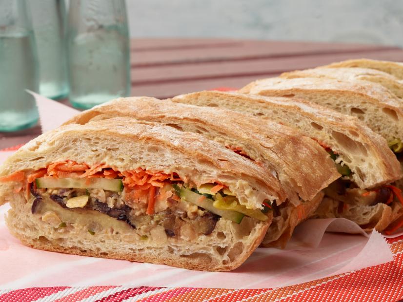 Food Network Kitchen’s Smashed Chickpea and Eggplant Sandwich Under a Brick for Summer Slow Cooker/Zucchini Fries/Picnic Brick-Pressed Sandwiches, as seen on Food Network.