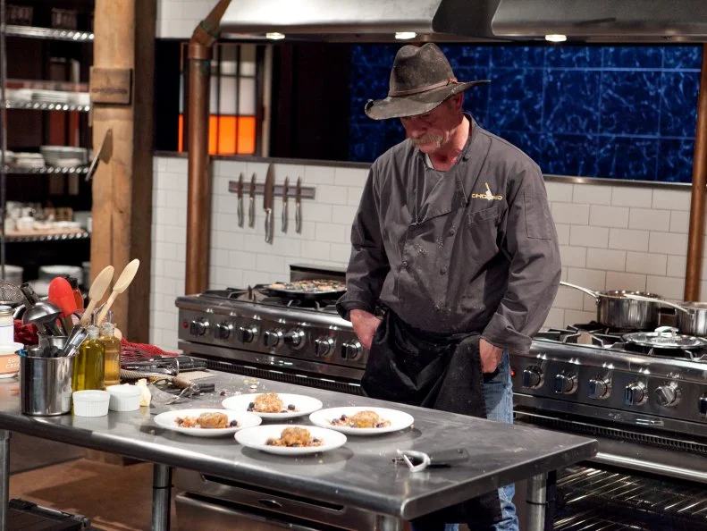 Chef Kent "Cook" Rollins looks at  his dessert for Chopped Redemption that must have included: Papaya, bubble tea, chocolate covered frozen bananas and coconut butter, as seen on Food Network’s Chopped, Season 17.