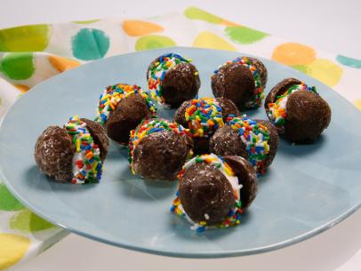 Donut hole ice cream sandwiches are displayed during an episode about the best snacks ever, as seen on Food Network's The Kitchen Sink, Season 1.